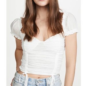 Super cute top looks great with skirts